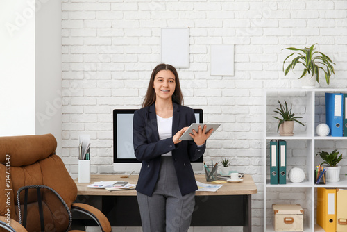 Female office worker using ...