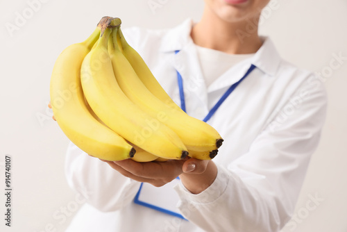 Female doctor with bananas ...