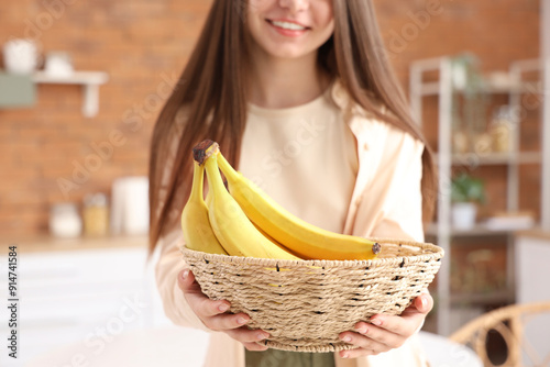 Young woman with bowl of ba...