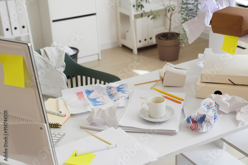 Messy workplace with coffee...