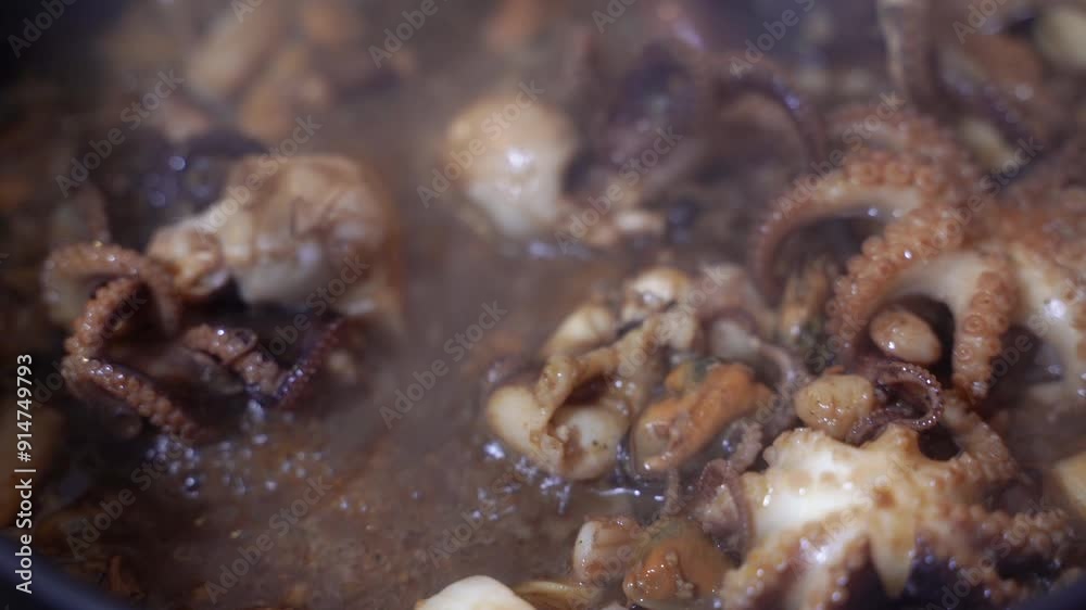 Seafood. Octopus is fried in a frying pan. Close-up.