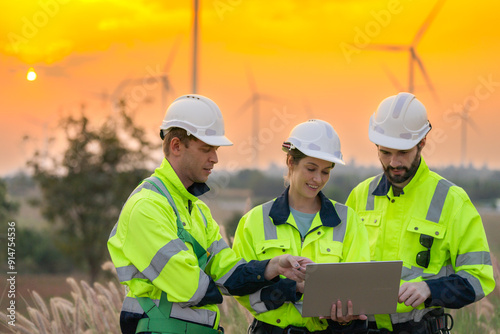 Team Engineers men and woman checking and inspecting on construction with sunset sky. people operation. Wind turbine for electrical of clean energy and environment. Industrial of sustainable.