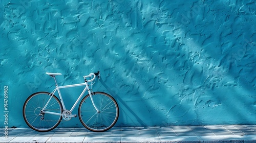 The bicycle stands against the background of a blue wall copy space High quality photo : Generative AI