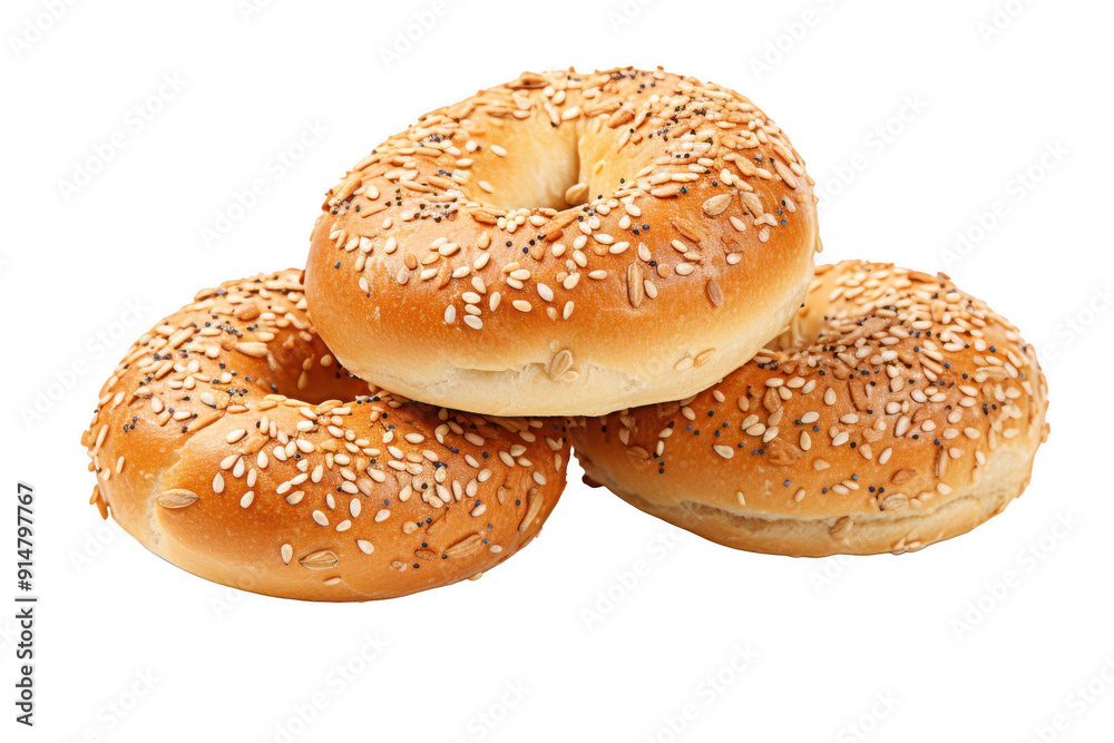 Three sesame seed bagels stacked on top of each other Three sesame seed bagels stacked on top of each other