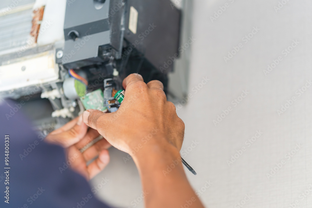 Repairman fixing and cleaning air conditioning system, Air Conditioning Repair, Male technician service for repair and maintenance of air conditioners. Repairman fixing and cleaning air conditioning system, Air Conditioning Repair, Male technician service for repair and maintenance of air conditioners.