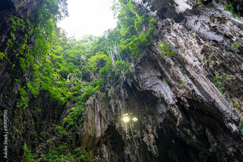 Batu Caves (Tamil: பத்து மலை, romanized: Pathu malai) is a mogote with a series of limestone caves in Gombak, Selangor, Malaysia. photo