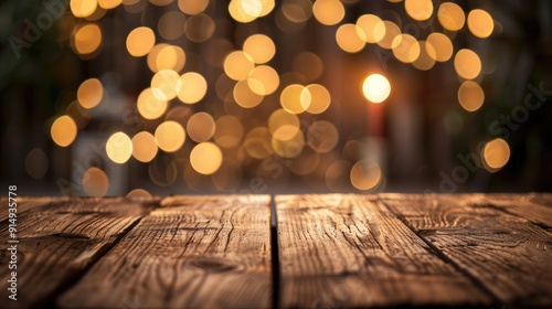 Wooden table top with blurred golden bokeh background for product display or design layout