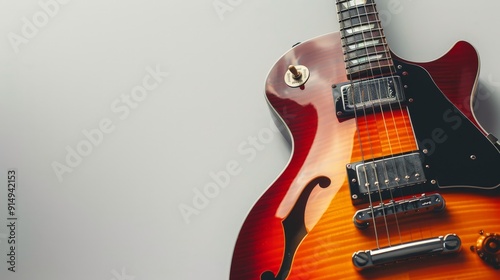 An electric guitar with a vibrant, glossy finish and detailed fretboard, set against a stark white background to emphasize its sleek design and modern appeal.