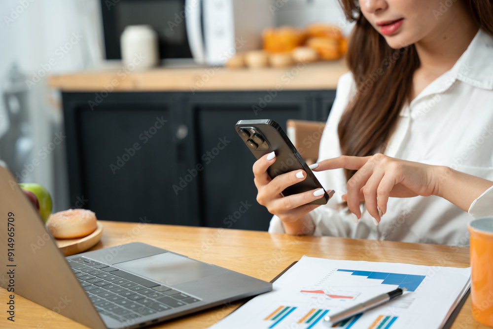Asian women Sitting and eating pizza with fruit in the kitchen Asian women Sitting and eating pizza with fruit in the kitchen