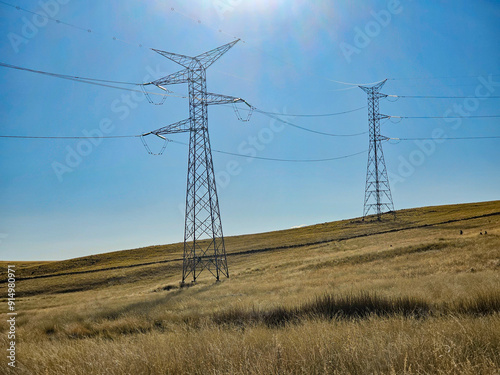 Row of High Voltage Electrical Towers in the Andes of South America