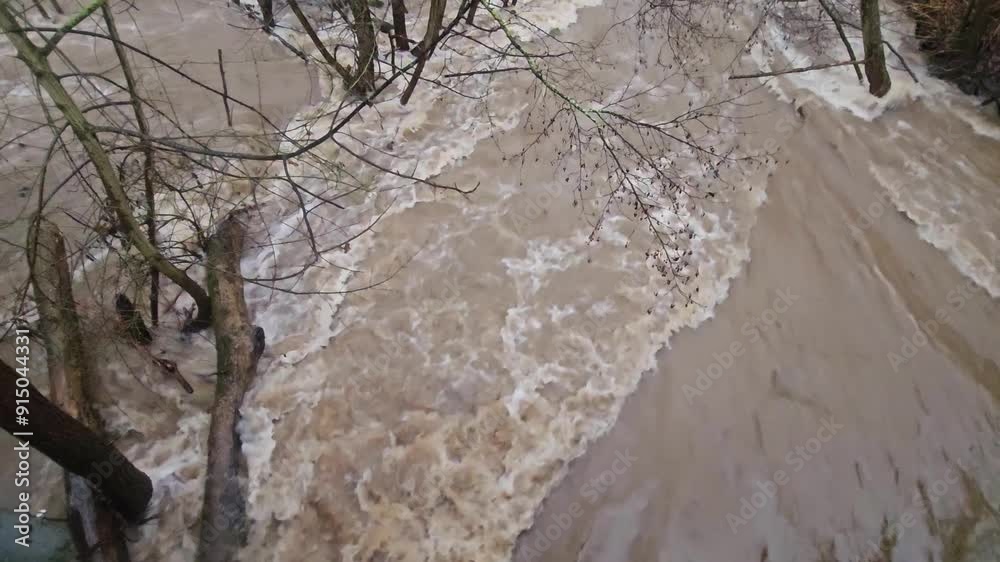 Mass of water in a storm The raging river after extreme weather. Mass of water in a storm The raging river after extreme weather.