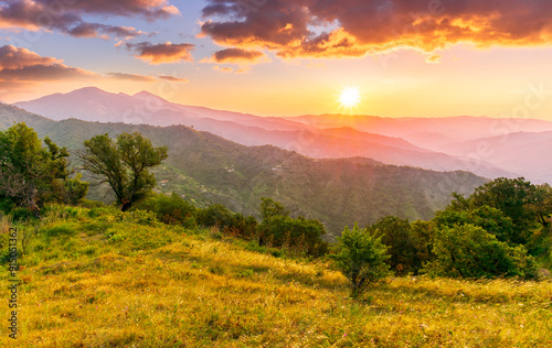 summer scenery mountain view from a highland hill to a beautiful sunset.