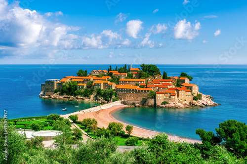 panoramic view of beautiful summer season sea landscape with amazing isle with antique orange roof buildings among water waves and nice sky clouds on background photo