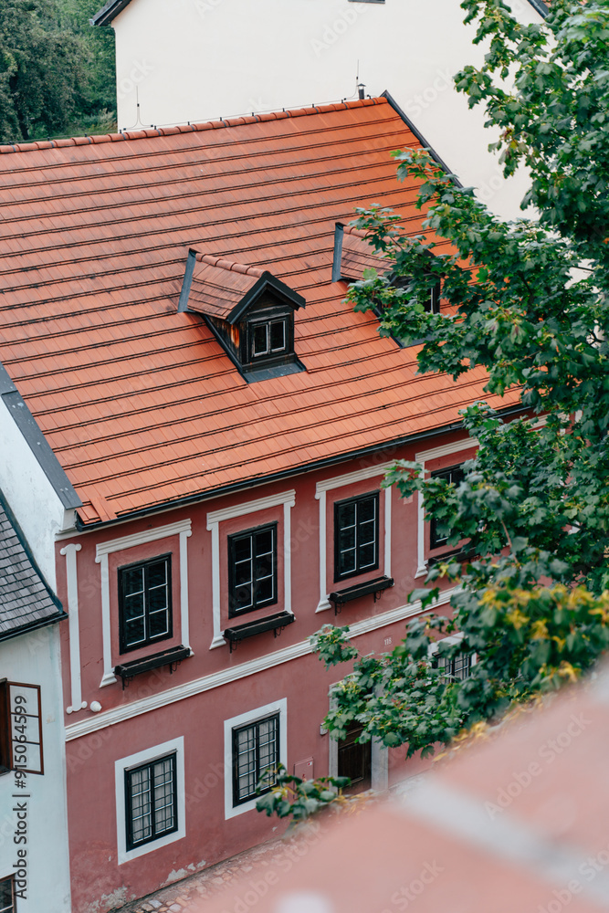 Historic Building With Red Roof Overlooking Green Trees in a Quaint Village Setting Historic Building With Red Roof Overlooking Green Trees in a Quaint Village Setting