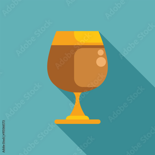 Glass of cognac standing on surface with long shadow