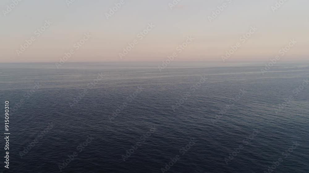 aerial view boundless water surface sea. Flying over surface sea at sunset. aerial seascape ocean surface. Travel concept aerial view boundless water surface sea. Flying over surface sea at sunset. aerial seascape ocean surface. Travel concept