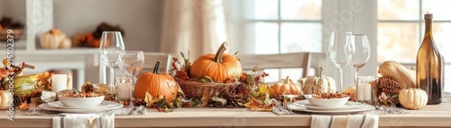 Rustic autumn table setting featuring pumpkins, candles, and harvest-themed decorations, creating a cozy and warm atmosphere for fall dining.