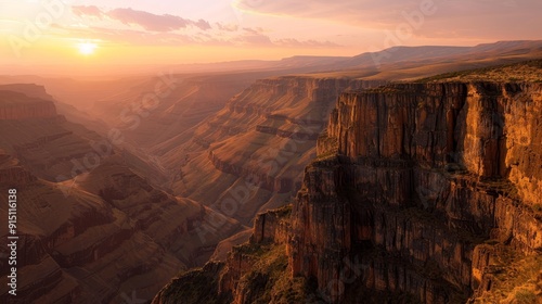 Sunset over a Deep Canyon with Rugged Cliffs and a Hazy Horizon