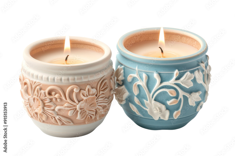 Two lit decorative candles in intricately designed ceramic holders, one beige and one blue, perfect for home decor and relaxation. Two lit decorative candles in intricately designed ceramic holders, one beige and one blue, perfect for home decor and relaxation.