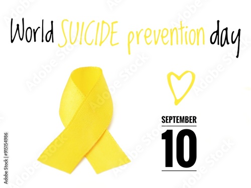 A minimalist poster with a white background featuring a yellow heart and a yellow ribbon, with the text World Suicide Prevention Day September 10 photo