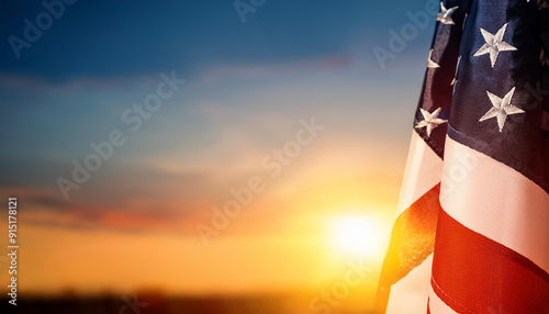 Majestic Sunrise Over an United States Flag Waving in the Foreground, Patriotic Themed Background Banner with Copy Space For Political Topics USA Flag Colors Presidential Election Vote photo