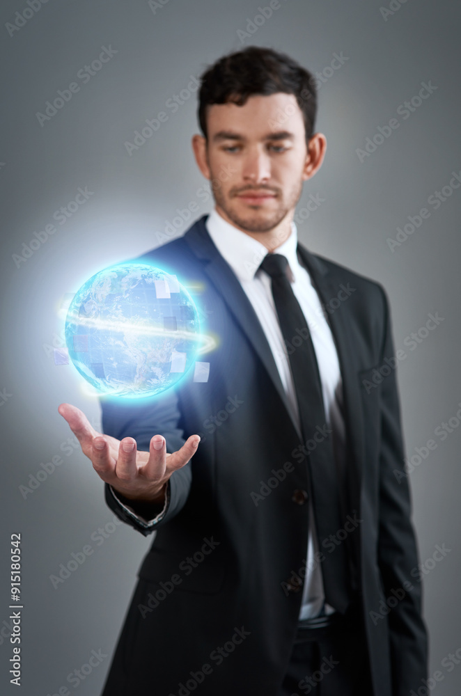 Businessman, economy and hologram of earth for trade industry and international relations in studio. Gray background, blue 3d orb and futuristic economist in finance career or global network control Businessman, economy and hologram of earth for trade industry and international relations in studio. Gray background, blue 3d orb and futuristic economist in finance career or global network control