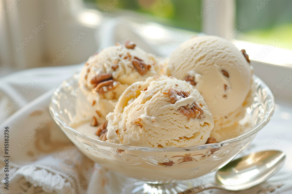 Butter pecan ice cream in glass dish Butter pecan ice cream in glass dish