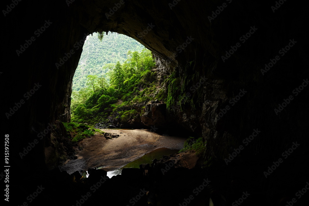 View through the cave entrance of Hang En Cave into lush jungle at Phong-Nha-ke-Bang National Park, Vietnam View through the cave entrance of Hang En Cave into lush jungle at Phong-Nha-ke-Bang National Park, Vietnam