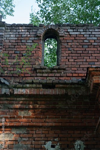 The old window of the stable is made of red brick. 19th century buildings