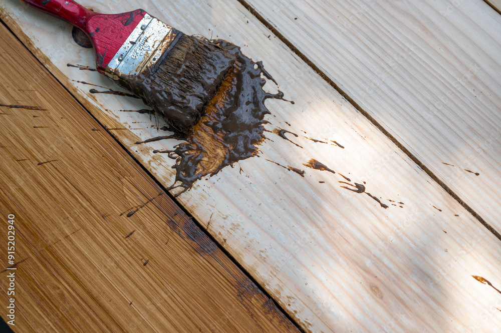 wooden background pine surface, slanted, walnut color, brown, top view of surface protection coating with a brush, painting, offset horizon wooden background pine surface, slanted, walnut color, brown, top view of surface protection coating with a brush, painting, offset horizon