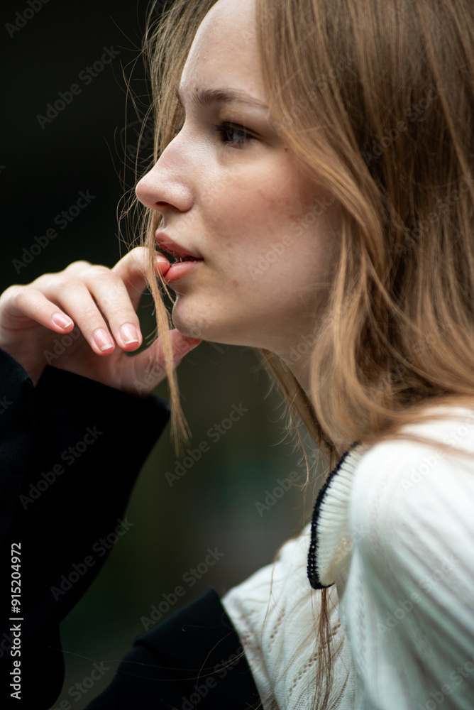 Young woman with long hair black jacket and white trousers street style Young woman with long hair black jacket and white trousers street style