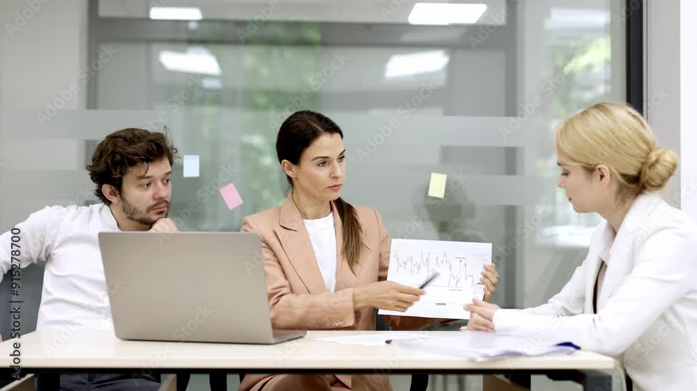 Ideal for teamwork, project management and business planning Colleagues in a modern office consult with each other while planning project details and financial strategies. Ideal for teamwork, project management and business planning Colleagues in a modern office consult with each other while planning project details and financial strategies.