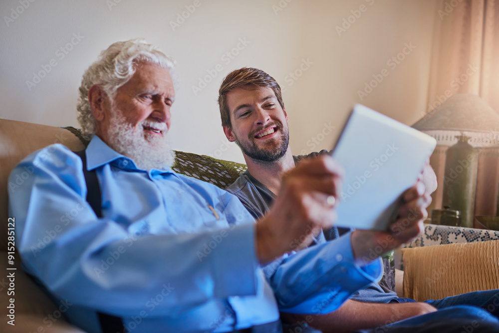 Obraz premium Man, grandfather and teaching with tablet on couch with helping hand for application, games or notification. People, family and digital touchscreen with virtual assistant for care at house in Croatia