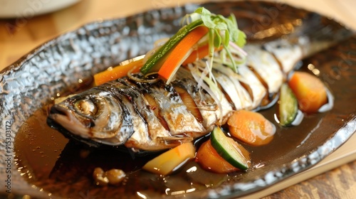 Black vinegar sauced pacific saury with vegetables photo