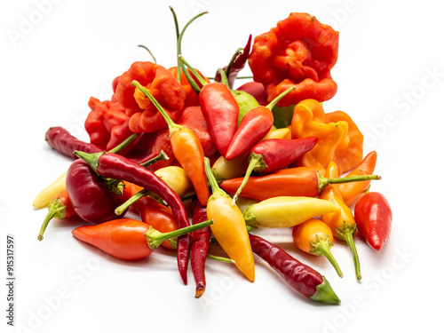 Fototapeta Naklejka Na Ścianę i Meble -  heap of colorful assorted chili peppers on a white background