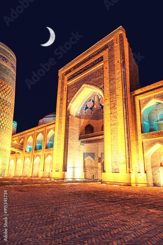 Kalta Minar and Muhammad Amin Khan Madrasah illuminated at night. photo