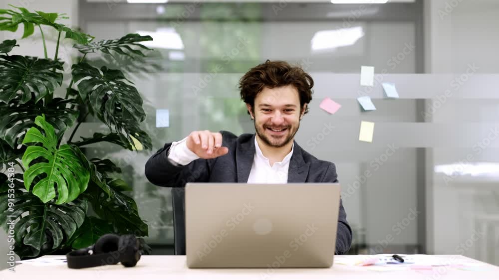 Office worker receives great news about completing a project, puts on headphones, and celebrates with an energetic dance at his desk. Perfect for showing end-of-day triumph and excitement. Office worker receives great news about completing a project, puts on headphones, and celebrates with an energetic dance at his desk. Perfect for showing end-of-day triumph and excitement.