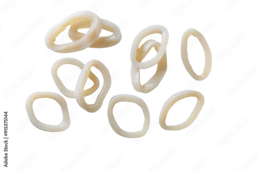 Falling squid rings close-up on a white background, cut. Sliced rings squid isolated . Falling squid rings close-up on a white background, cut. Sliced rings squid isolated .