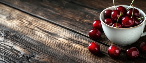Fresh cherries in a cup on ...