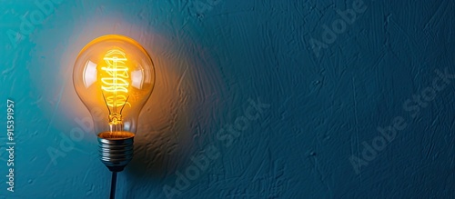 Yellow light bulb on a blue...