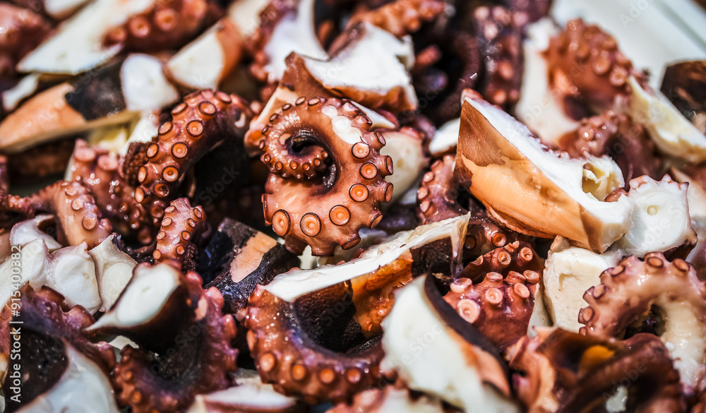 Seafood. Pieces of fresh octopus for cooking