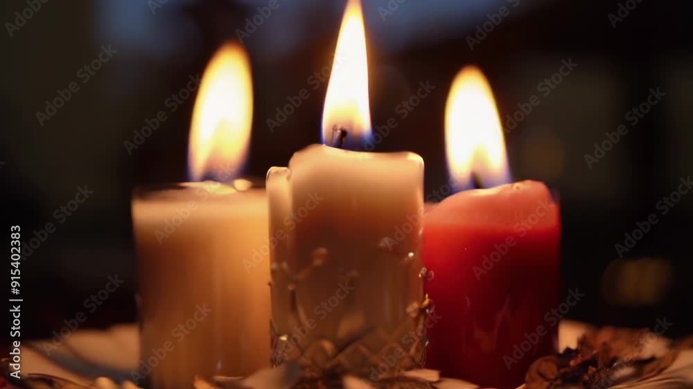 Three Burning Candles in the Dark Close-Up Three Burning Candles in the Dark Close-Up