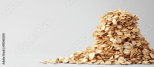 Stack of dry oat flakes wit...