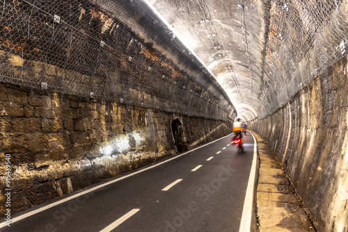 Obraz na płótnie Biking through tunnel on the alpe adria cycle route ( Pontebanna ) through the Val Canale in Italy w salonie