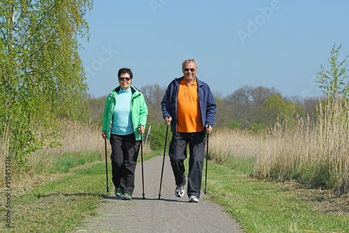 Senior couple doing Nordic walking