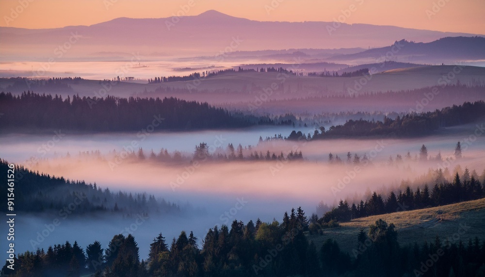 Fog rolling over a valley at dawn Fog rolling over a valley at dawn