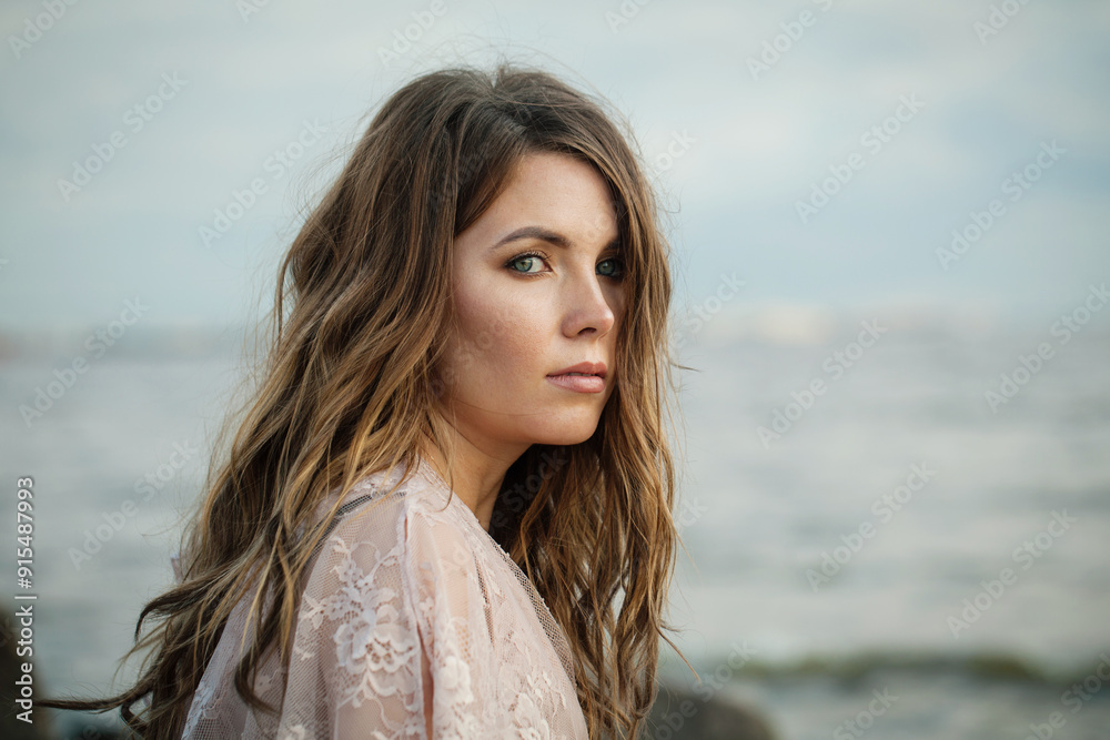 Pensive young adult female model with windy brown hair walking outdoor Pensive young adult female model with windy brown hair walking outdoor