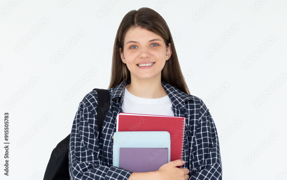 Caucasian girl student in blue shirt with folder, books, notebook, notepad in hands smiling isolated on white studio background, copy space Caucasian girl student in blue shirt with folder, books, notebook, notepad in hands smiling isolated on white studio background, copy space