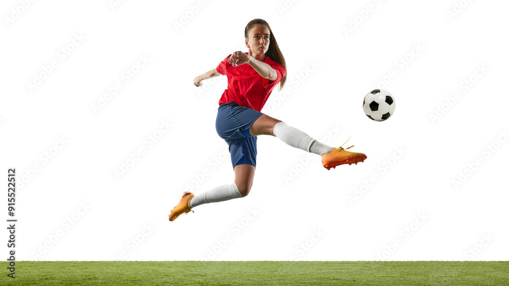 Fototapeta premium Woman, focused scorer, football player, dressed comfy sportswear, leaping in mid-air, aiming to opponents gates on green stadium. Concept of women and sport, team games, movement, victory, action. Ad