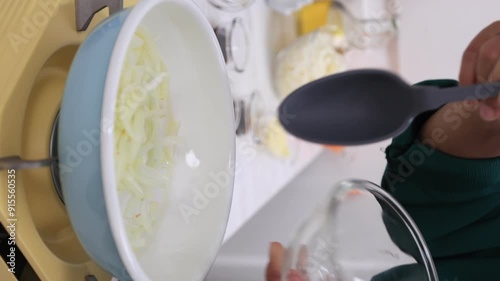 Wallpaper Mural Female Hand Pour  Sliced Onion to the Pan and Stir Frying Torontodigital.ca